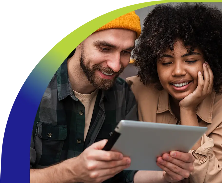 Smiling couple browsing on a tablet together, representing seamless digital connectivity and high-speed internet access.